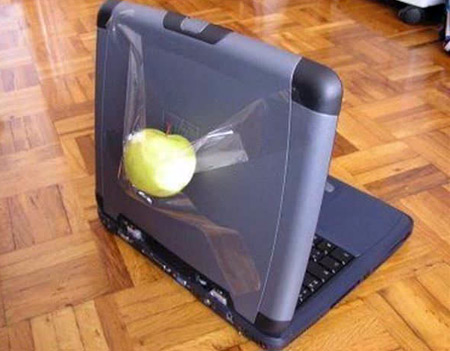 lap top with apple duck tap to it